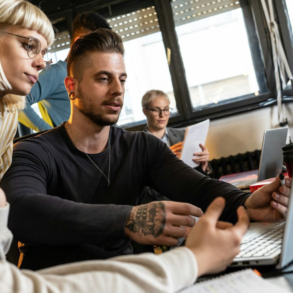 Group of casual team workers and programmers working on a new project