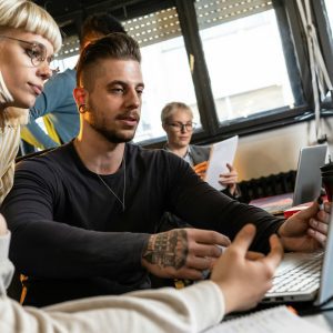 Group of casual team workers and programmers working on a new project