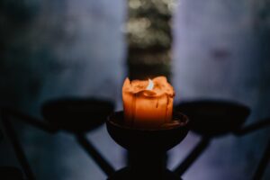 candle in the shadows / religion / grief
