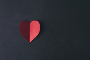 Red Hearth paper on black background