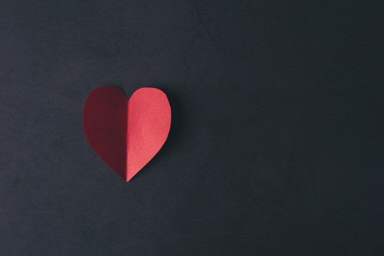 Red Hearth paper on black background