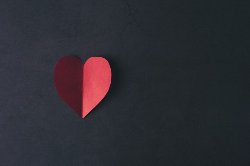 Red Hearth paper on black background