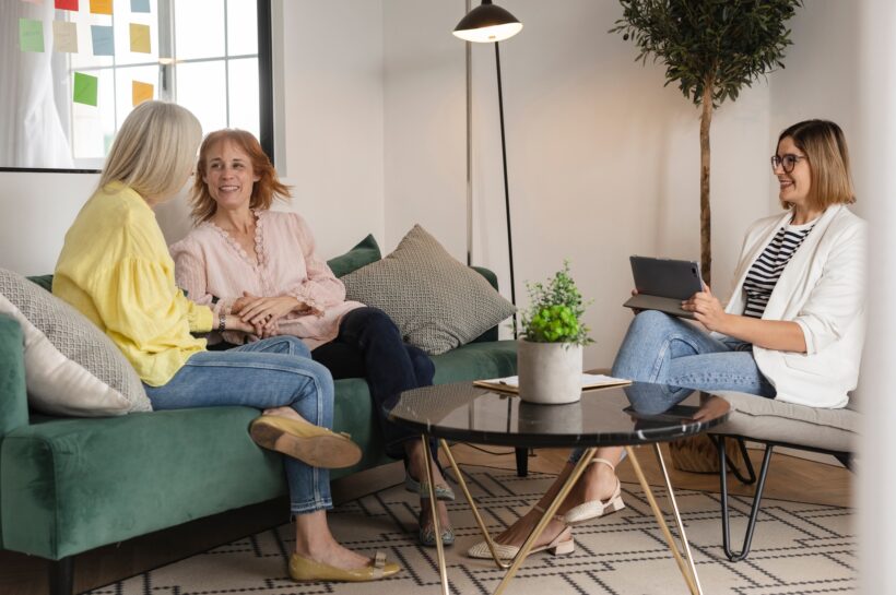 lesbian couple therapy with their psychotherapist reconciling