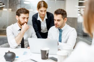 Team leader with employees in the office