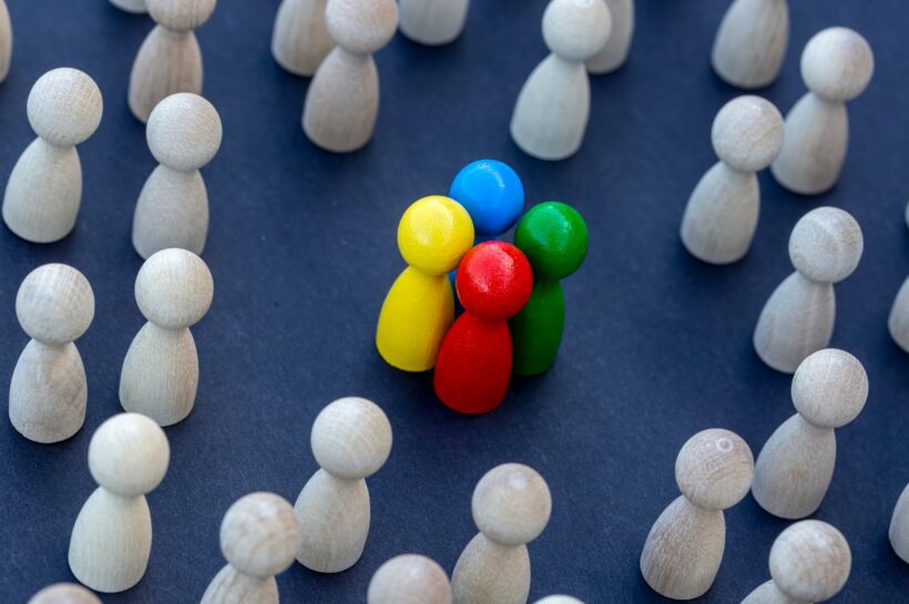 To be different, to be a leader, to lead. icon expression with colorful wooden figures.