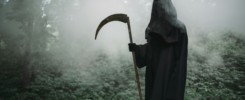 Death with a scythe in the dark misty forest