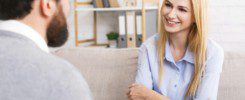 Friendly woman patient talking to psychological consultant