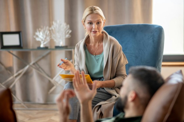 Psychologist providing psychological support to a man