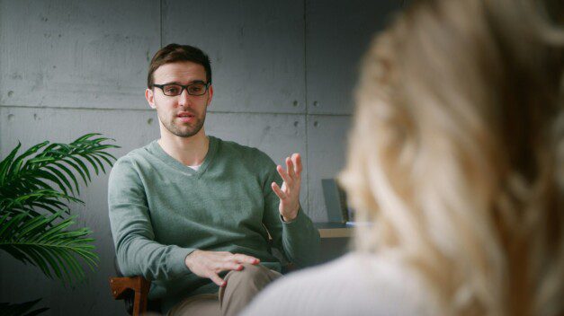 The psychotherapist explaining the plan to the patient